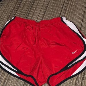 Red and Black Nike running shorts